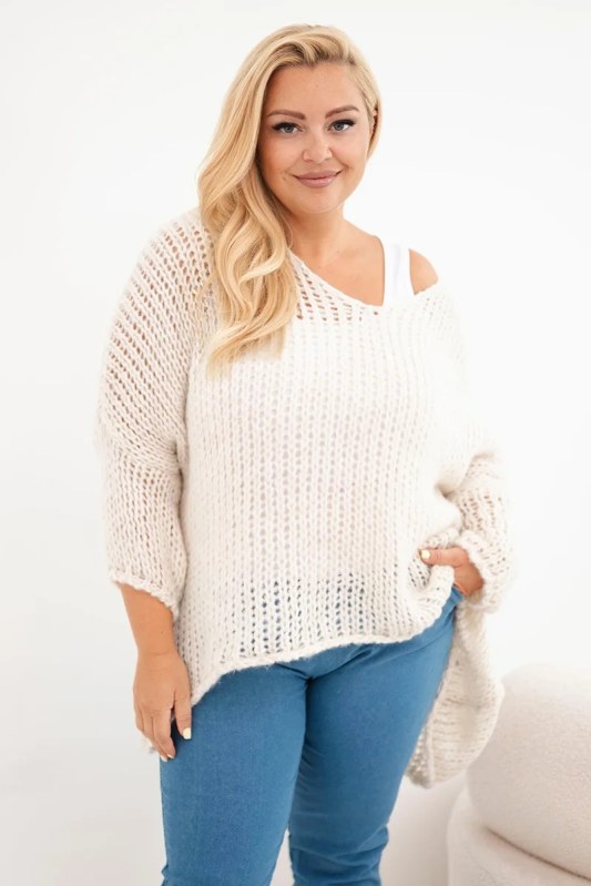 Dámský svetr oversized se vzorem a výstřihem do V a delším zadním dílem béžový